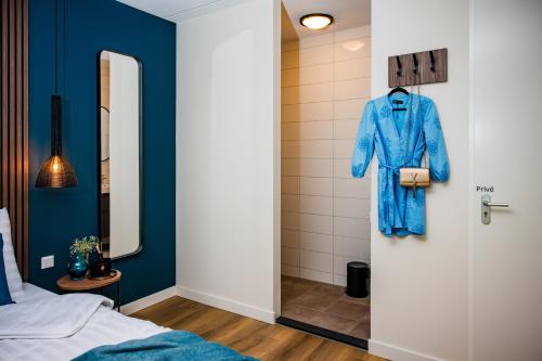 Ένα ή περισσότερα κρεβάτια σε δωμάτιο στο Recreatiewoning 'Steenpatrijs' op Christelijk Vakantiepark