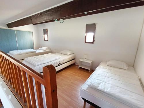 Ένα ή περισσότερα κρεβάτια σε δωμάτιο στο Maison de campagne