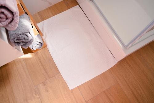an overhead view of a room with a rug on the floor at Apartmani Natalija 4 Stars in Mrljane