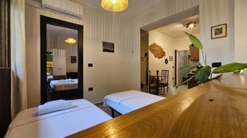 a hospital room with two beds and a mirror at UnionBNB Apartments in Tirana