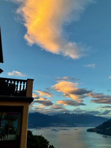 a view of the water from a balcony of a building at Villa Diomira in Cannobio