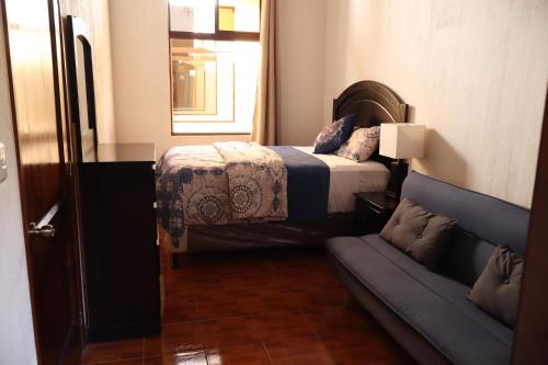 Postel nebo postele na pokoji v ubytování Hotel Senderos de Alux