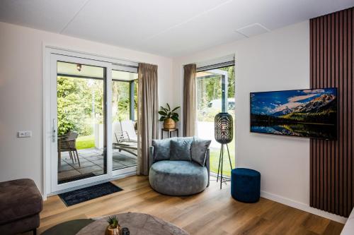 Χώρος καθιστικού στο Recreatiewoning 'Dwergarend' op Christelijk Vakantiepark