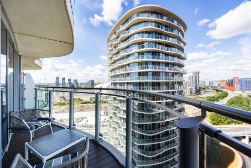 a balcony with a view of a tall building at Austin David Executive ExCeL in London