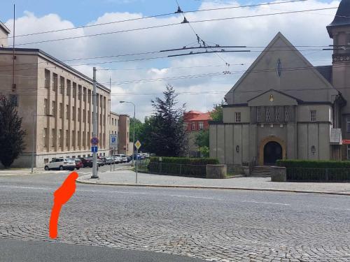 a painting of a person on the side of a street at Byt Komenskeho #1# v historickém centru Hradec Králově 60m2 in Hradec Králové