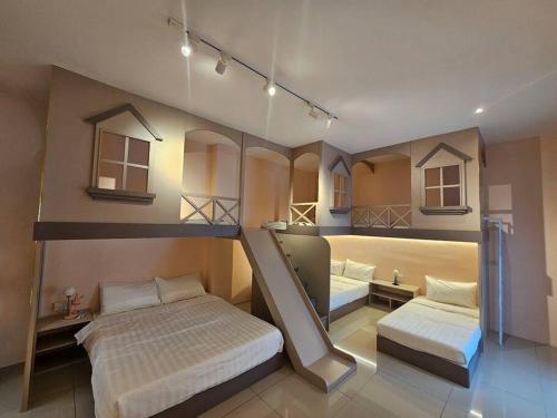 a bedroom with two bunk beds and a mirror at jia Residence 21 pax Karaoke & Snooker in Ipoh
