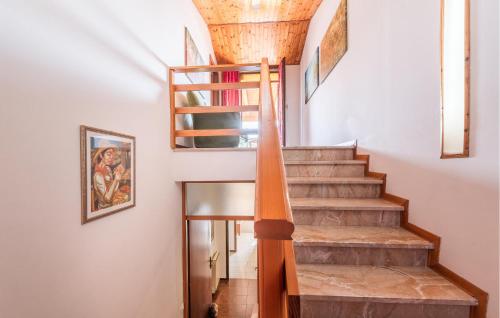 a staircase in a home with a wooden ceiling at Casa Lucia in Villadose