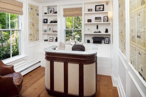 a home office with a round island in a room at 76 Main Ink Press Hotel in Nantucket