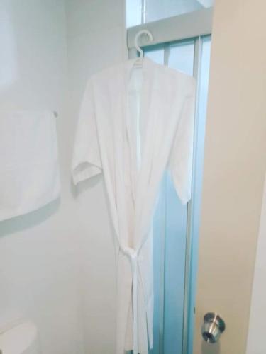 a white shower curtain hanging in front of a window at 1 Bedroom Seaview Jomtein Pattaya 33sqm floor9th 90 3 in Jomtien Beach
