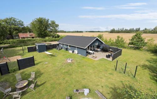 an aerial view of a house in the middle of a field at 3 Bedroom Cozy Home In Ulfborg in Ulfborg