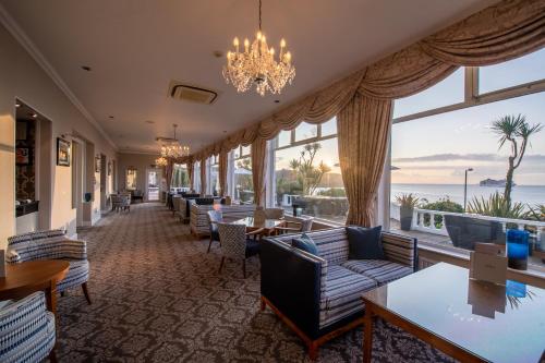 a hotel lobby with couches and tables and windows at The Royal Duchy Hotel in Falmouth