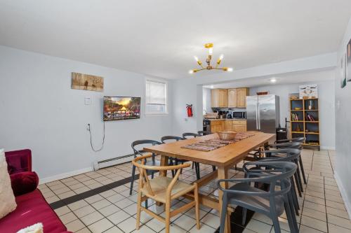 a kitchen and dining room with a table and chairs at 9 Bedroom, 14 Beds House Great for Big Groups Near Boardwalk, Tropicana in Atlantic City
