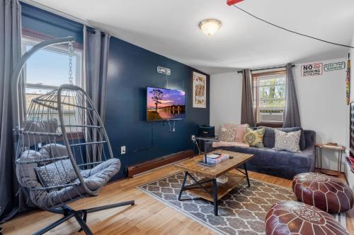 a living room with a couch and a chair at 9 Bedroom, 14 Beds House Great for Big Groups Near Boardwalk, Tropicana in Atlantic City