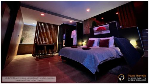 a bedroom with a large bed with a purple blanket at Pause Thermale Suites Deluxe et Spa Privatif in Herstal