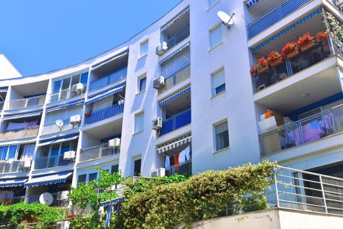 an apartment building with clothes on the balconies at Apartment Marija in Split