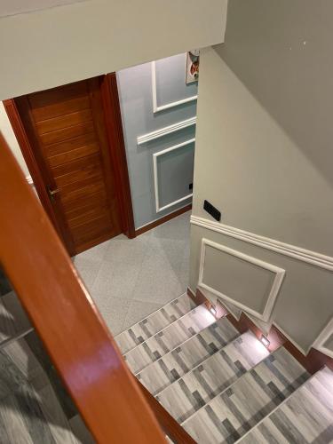 a staircase leading up to a door in a building at Triple s homes in Arusha