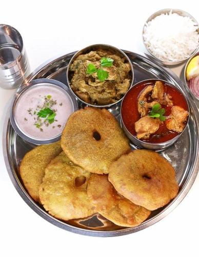 a plate of food with different types of food at Whiteville Villa in Nandgaon