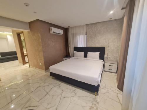 Postel nebo postele na pokoji v ubytování El Mesaadya Hotel فندق المساعدية