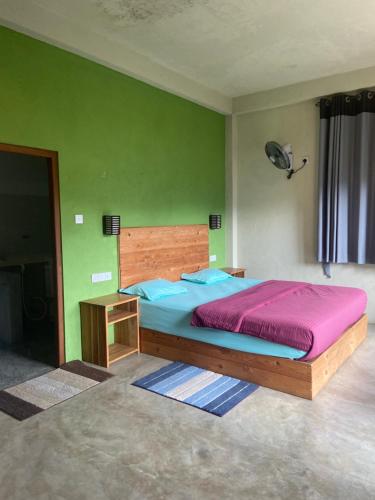 Postel nebo postele na pokoji v ubytování Raveena Guest House