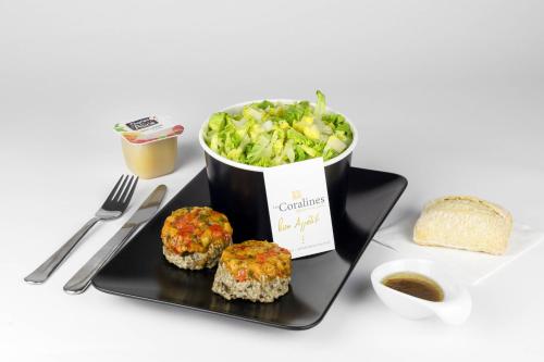 a plate of food with a bowl of broccoli and bread at Appart Hôtel Coraline - Genas Lyon Eurexpo in Genas