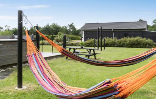 a hammock in a park with a picnic table at Nice Home In Hemmet With Wifi in Hemmet