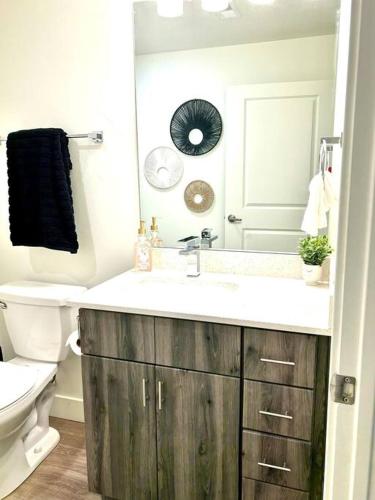 a bathroom with a sink and a toilet at Delta Center Downtown Retreat in Salt Lake City