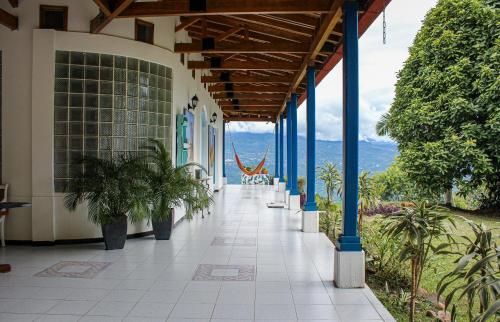 a hallway of a building with a view of the ocean at Hacienda Siete Sentidos in La Mesa