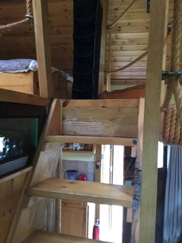 two views of the inside of a log cabin at Traditional 18th century converted stables in Wexford