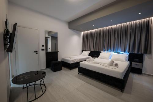 Postel nebo postele na pokoji v ubytování Euphoria Apartments