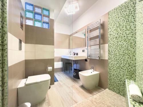 a bathroom with a toilet and a sink at Home4Apartment Salerno center, with private patio in Salerno