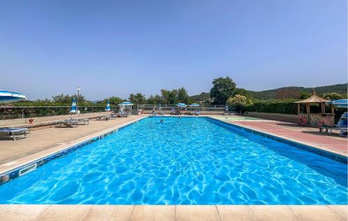a large blue swimming pool with blue water at Lovely Apartment In San Feliciano in San Feliciano