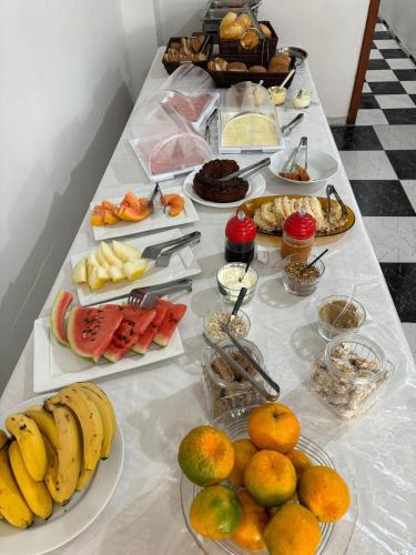 a table with many different types of fruit on it at Hotel São Luis in Pinhão