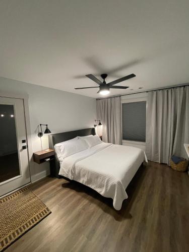 a bedroom with a bed and a ceiling fan at Couples Getaway-Dual-Head Shower for Two in Sautee Nacoochee