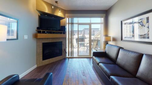 a living room with a couch and a fireplace at Sooke Harbour Getaway in Sooke