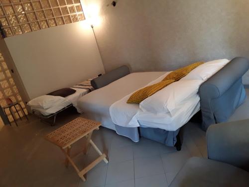 Katil atau katil-katil dalam bilik di Residenza Locatelli