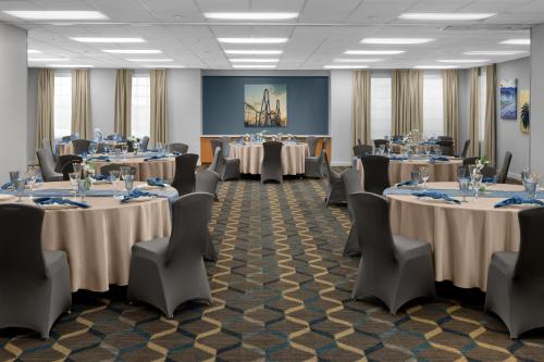 a conference room with tables and chairs and tablesktop at Residence Inn by Marriott Santa Clarita Valencia in Santa Clarita