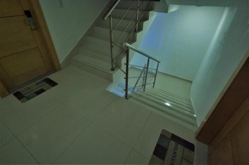 an overhead view of a staircase with a metal railing at La Yarolina in Punta Cana