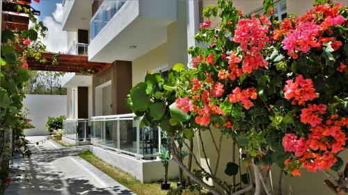 a building with flowers on the side of it at La Yarolina in Punta Cana