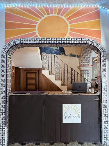 an archway leading into a room with a staircase at Sunset Hostel - Centro - in La Paz