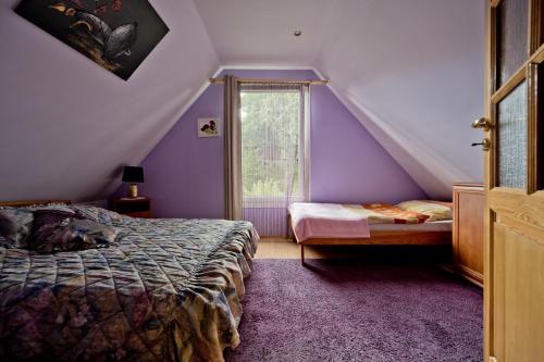Postel nebo postele na pokoji v ubytování Domki Ranczo w Dolinie
