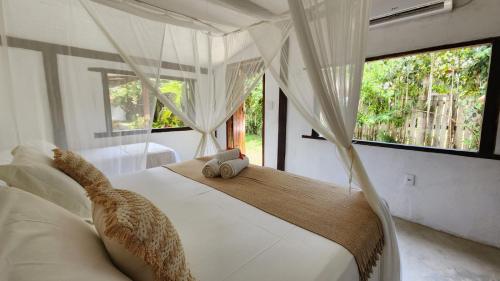 Cama o camas de una habitación en Villa Luar Caraíva - Pé na areia