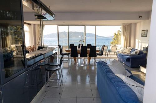 a living room with a view of the ocean at Salamina Blue Horizon House in Eantio