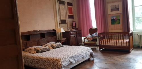 Postel nebo postele na pokoji v ubytování La Miséricorde