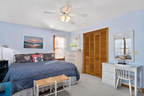a bedroom with a bed and a ceiling fan at W13 Wedges 13 in Nags Head