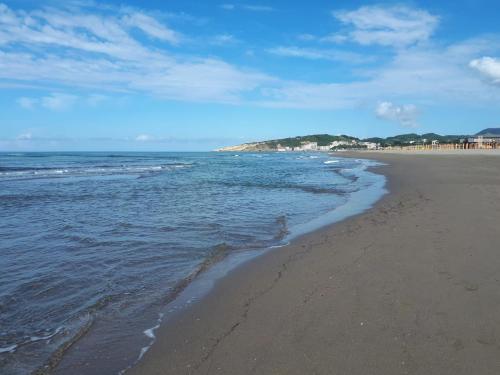 a beach with the ocean and the shoreline at House Munich - Montenegro in Donji Štoj