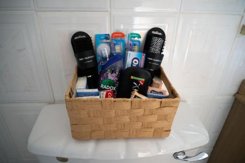 a basket on top of a toilet in a bathroom at The Scotch Rock in Castlewellan