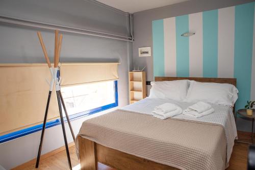 Postel nebo postele na pokoji v ubytování Port Alley - Old Port Chania -Pet Friendly