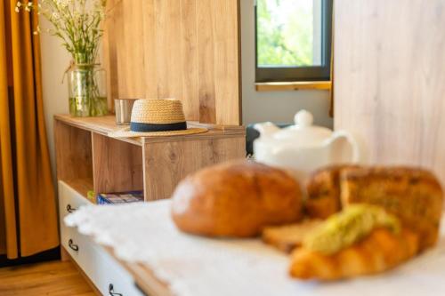 two loaves of bread sitting on top of a counter at Zielona Żaba in Derc