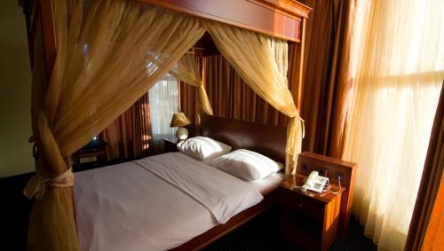 Ένα ή περισσότερα κρεβάτια σε δωμάτιο στο Hotel Ana