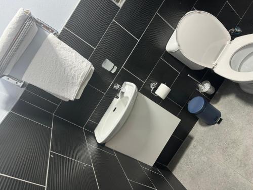 a bathroom with a toilet and a bidet at Kv Luxury Guest House in Johannesburg
